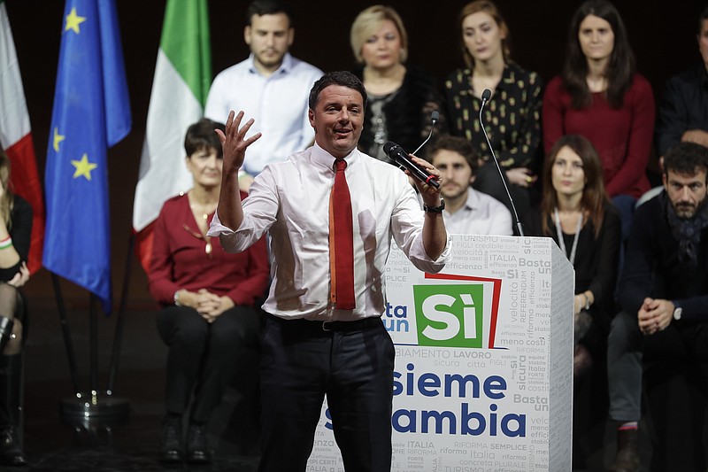 
              FILE - In this Saturday, Nov. 26, 2016 file photo, Italian premier Matteo Renzi talks during a demonstration to support the vote "YES" in the December 4 constitutional referendum, in Rome. Italians will be called on Dec. 4 to vote, in a referendum proposed by Renzi's government, over a reform that if approved will change the country's Constitution adopted in 1947. A yes-or-no referendum Sunday on government-championed constitutional reforms has been transformed by rivals into a virtual plebiscite on the 41-year-old leader, Italy’s youngest. A win by the “No” camp would be expected to trigger Renzi’s resignation. (AP Photo/Andrew Medichini, File)
            