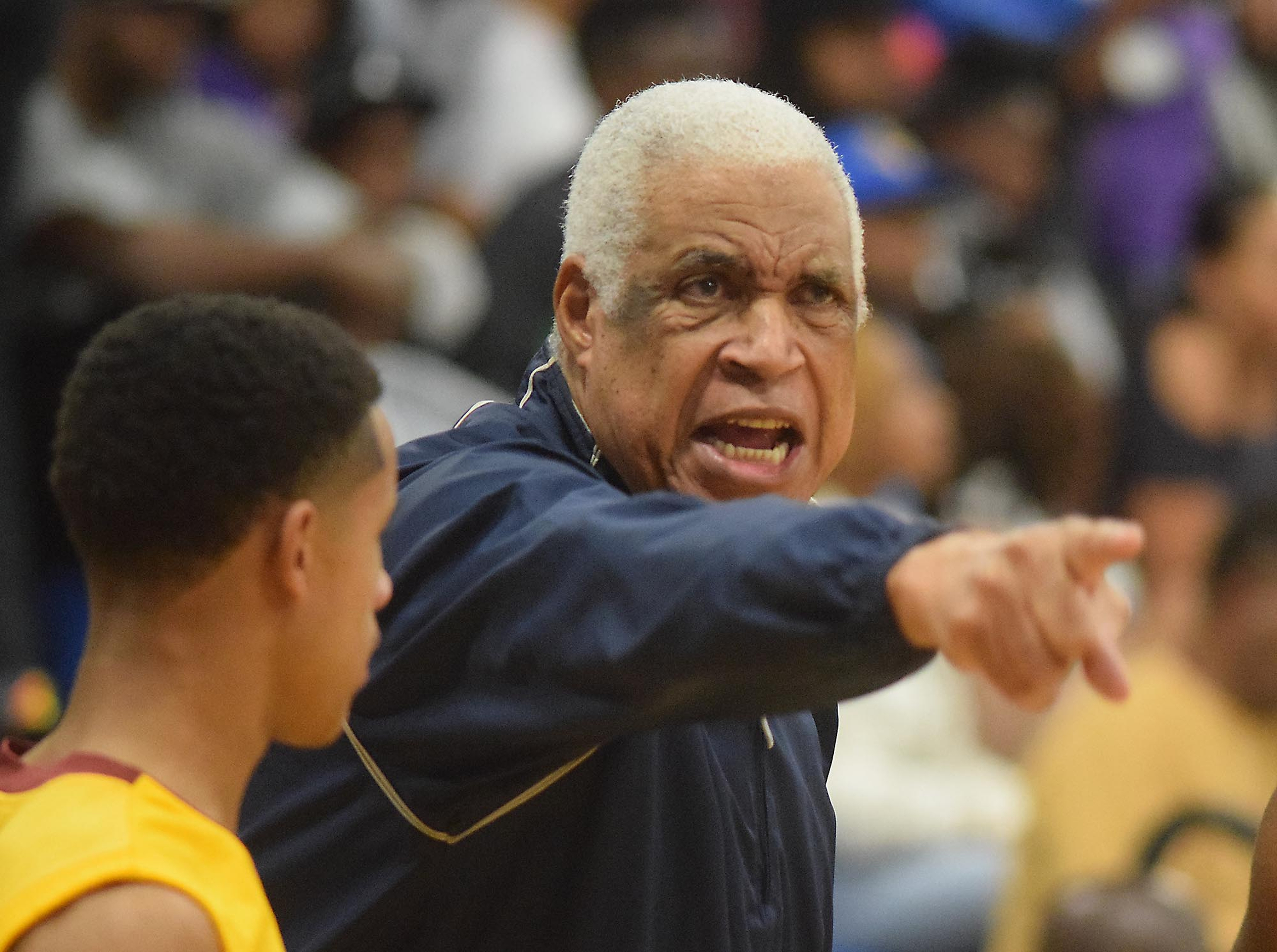 Howard coach Walter McGary directs his team. The Howard Hustlin Tigers visited the Brainerd Panthers in TSSAA basketball action on December 2, 2016.