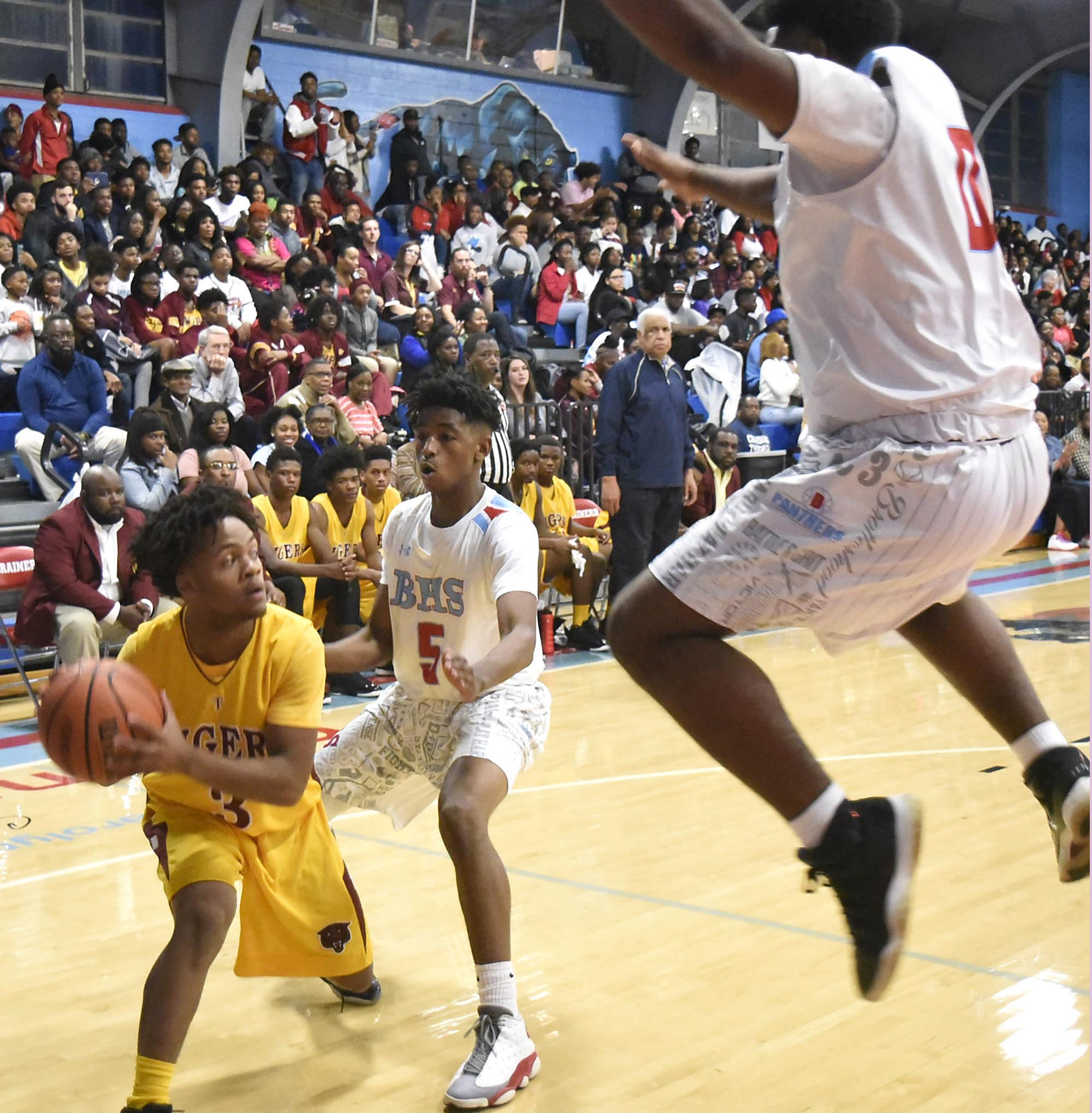 Brainerd's Keyshun Bradley (5) and Jamaul Herman Jr. (0) try to trap Howard's Marquez Willams (3). The Howard Hustlin Tigers visited the Brainerd Panthers in TSSAA basketball action on December 2, 2016.
