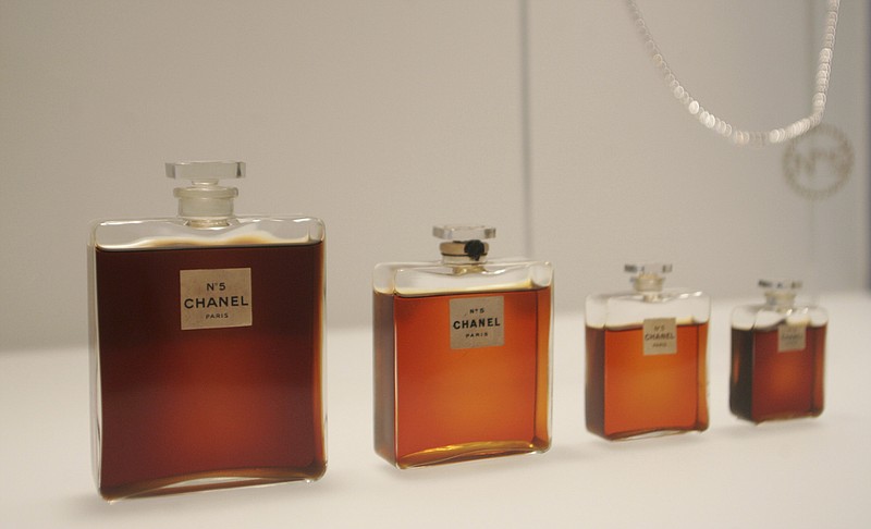 
              FILE - In this May 2, 2005 file photo, bottles of Chanel No. 5 perfume are displayed at the Metropolitan Museum of Art's Costume Institute exhibit in New York. Chanel is making a stink over a possible high-speed train line through jasmine fields in Provence, warning it could threaten production of its Chanel No. 5 perfume. (AP Photo/Hiroko Masuike, File)
            
