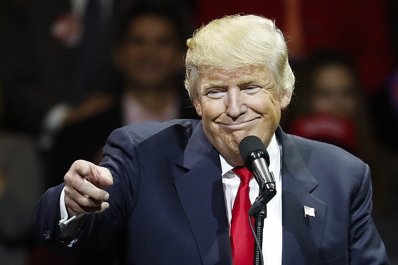 
              President-elect Donald Trump smiles as he speaks during the first stop of his post-election tour, Thursday, Dec. 1, 2016, in Cincinnati. (AP Photo/John Minchillo)
            