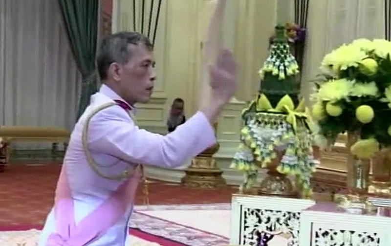 
              In this image made from video, Thailand's Crown Prince Maha Vajiralongkorn,  gestures near a portrait of his late father at the Grand Palace in Bangkok, Thailand, Thursday, Dec. 1, 2016. The new monarch, who received the title "His Majesty King Maha Vajiralongkorn Bodindradebayavarangkun," assumed his new position Thursday, according to an announcement broadcast on all TV channels. He will also be known as Rama X, the tenth king in the Chakri dynasty that was founded in 1782. (Thai TV Pool via AP)
            