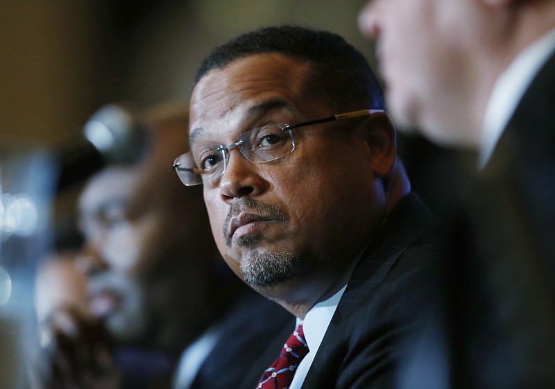 
              U.S. Rep. Keith Ellison, center, D-Minn., listens with Jamie Harrison, back, chair of the South Carolina Democratic Party, as Ray Buckley, chair of the party in New Hampshire, speaks during a forum on the future of the Democratic Party, featuring candidates running to be the next chair of the Democratic National committee on Friday, Dec. 2, 2016, in Denver. The candidates spoke during the Association of State Democratic Chairs session. (AP Photo/David Zalubowski)
            
