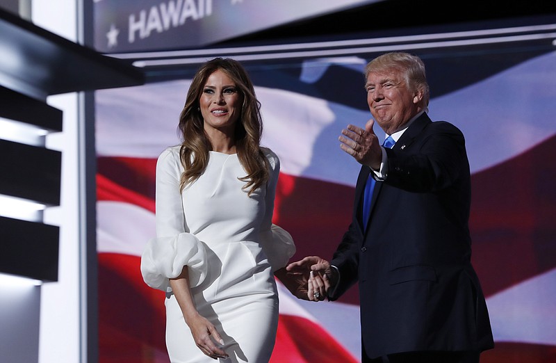 
              FILE - In this July 18, 2016, file photo, Melania Trump, wife of Republican Presidential Candidate Donald Trump walks to the stage as Donald Trump introduces her during the opening day of the Republican National Convention in Cleveland. Fashion designer Tom Ford said on ABC's "The View" Wednesday, Nov. 30, 2016, that he had had been asked to dress Mrs. Trump “quite a few years ago” and declined because “she’s not necessarily my image.” (AP Photo/Carolyn Kaster, File)
            