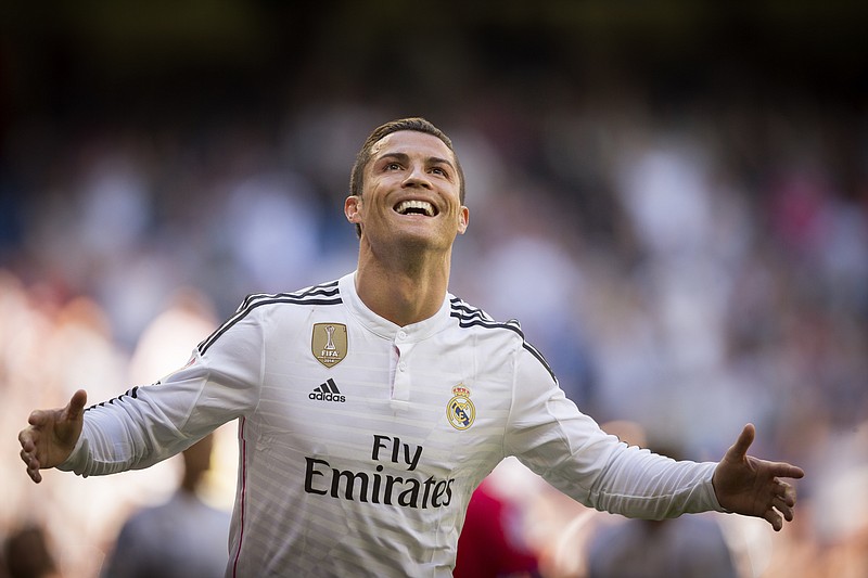 
              FILE - In this April 5, 2015, file photo, Real Madrid's Cristiano Ronaldo celebrates after scoring a goal during a La Liga soccer match against Granada at the Santiago Bernabeu stadium in Madrid. A group of European media outlets on Friday, Dec. 2, 2016, published what it claims are details of tax arrangements made by several top soccer players and coaches, including Ronaldo, Manchester United manager Jose Mourinho and Arsenal midfielder Mesut Ozil. (AP Photo/Daniel Ochoa de Olza, File)
            