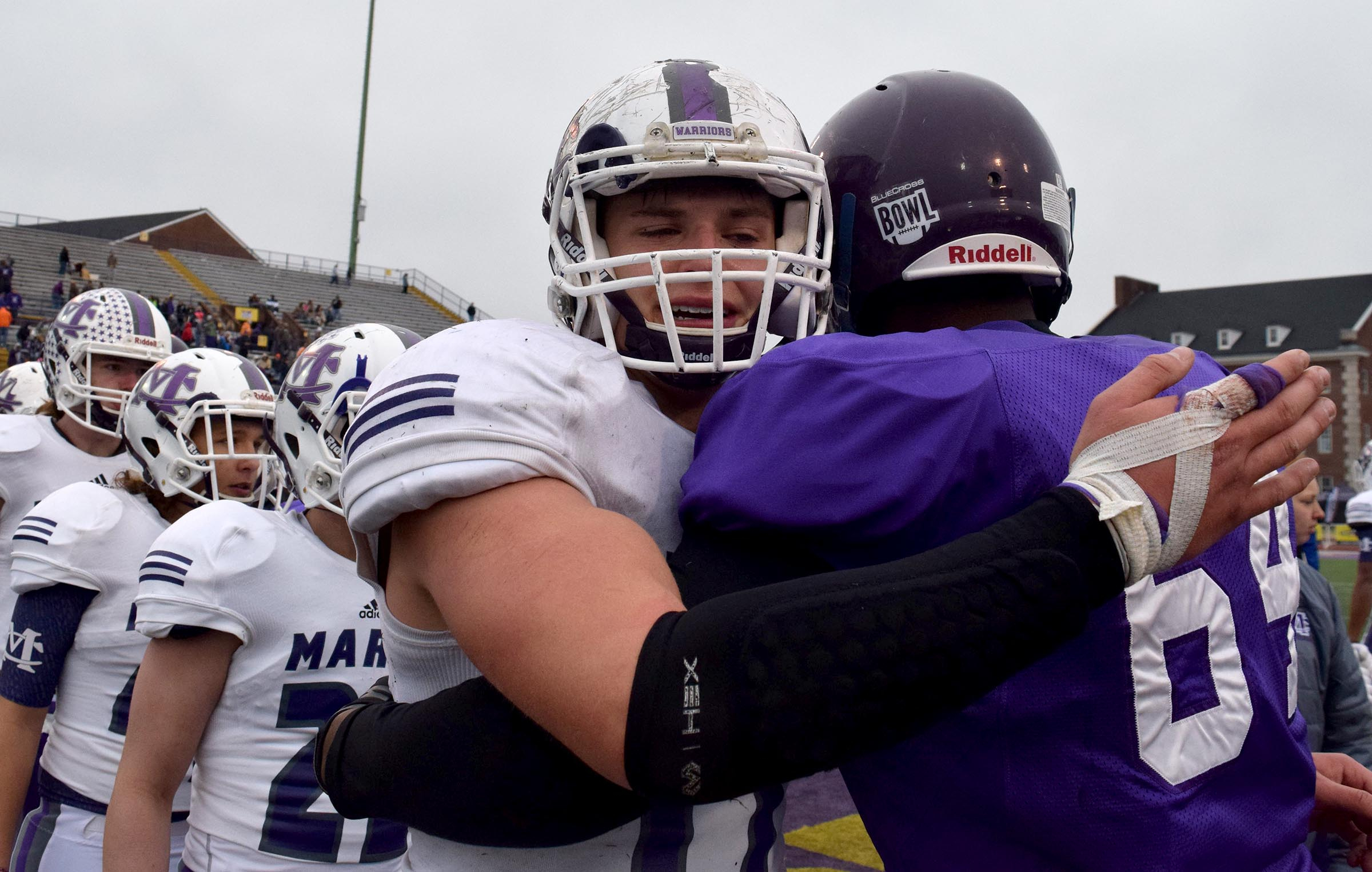 Marion County's Alex Kirkendoll (17) hugs Trezevant's Antwan Hopkins (64) in a show of mutal respect. The Marion County Warriors faced the Memphis Trezevant Bears in the Class AA TSSAA State Football Championship played in the BlueCross Bowl at Tennessee Tech in Cookeville on December 3, 2016.