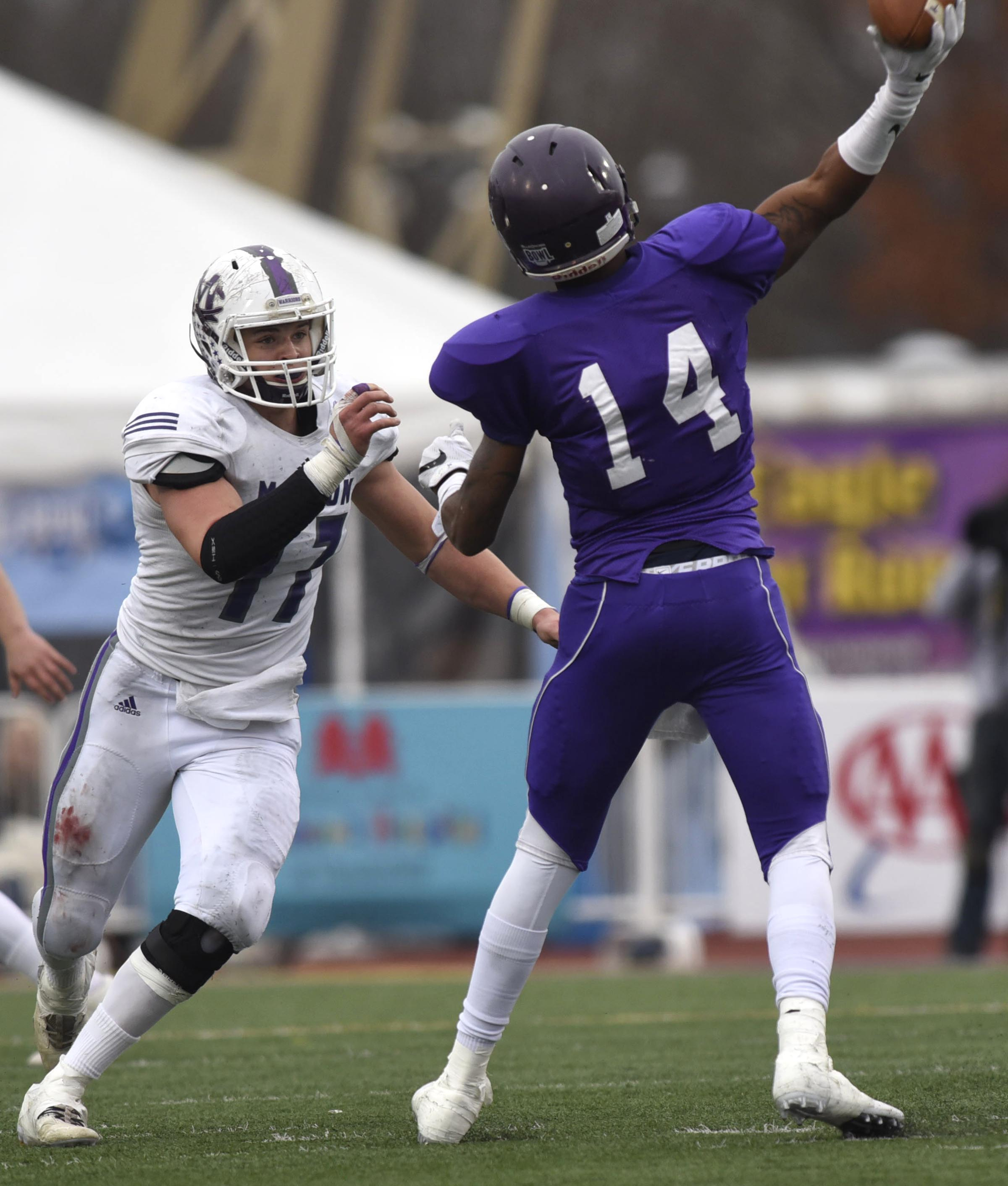 Marion County's Alex Kirkendoll (17) pressures Trezevant quarterback Tywon Johnson (14). The Marion County Warriors faced the Memphis Trezevant Bears in the Class AA TSSAA State Football Championship played in the BlueCross Bowl at Tennessee Tech in Cookeville on December 3, 2016.