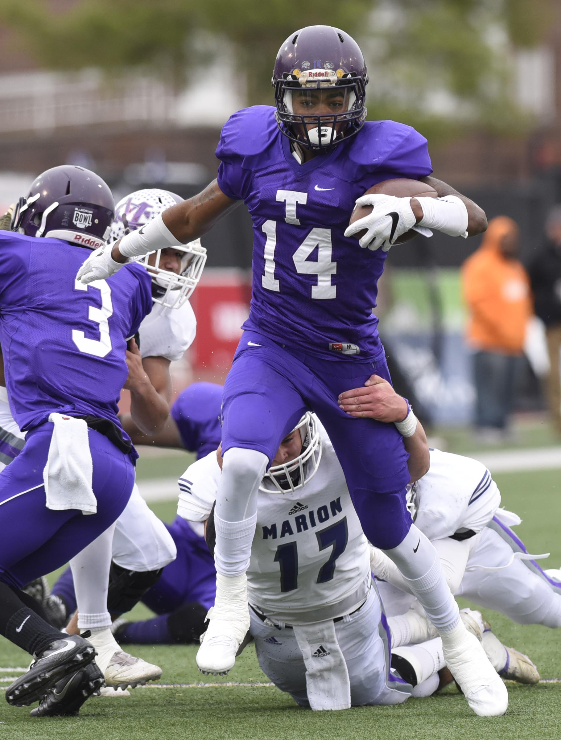 Marion County's Alex Kirkendoll (17) pulls down Trezevant quarterback Tywon Johnson (14). The Marion County Warriors faced the Memphis Trezevant Bears in the Class AA TSSAA State Football Championship played in the BlueCross Bowl at Tennessee Tech in Cookeville on December 3, 2016.