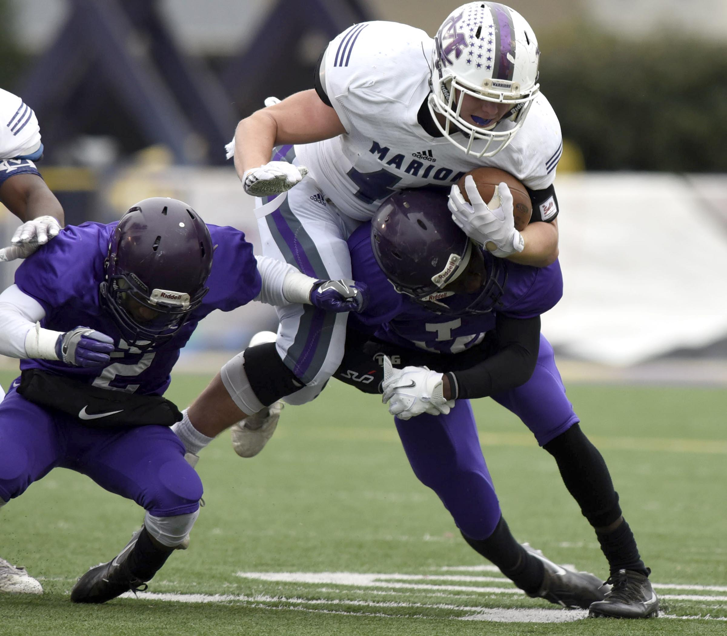 Marion County's Hunter McClain (40) is brought down by two Bear defenders. The Marion County Warriors faced the Memphis Trezevant Bears in the Class AA TSSAA State Football Championship played in the BlueCross Bowl at Tennessee Tech in Cookeville on December 3, 2016.