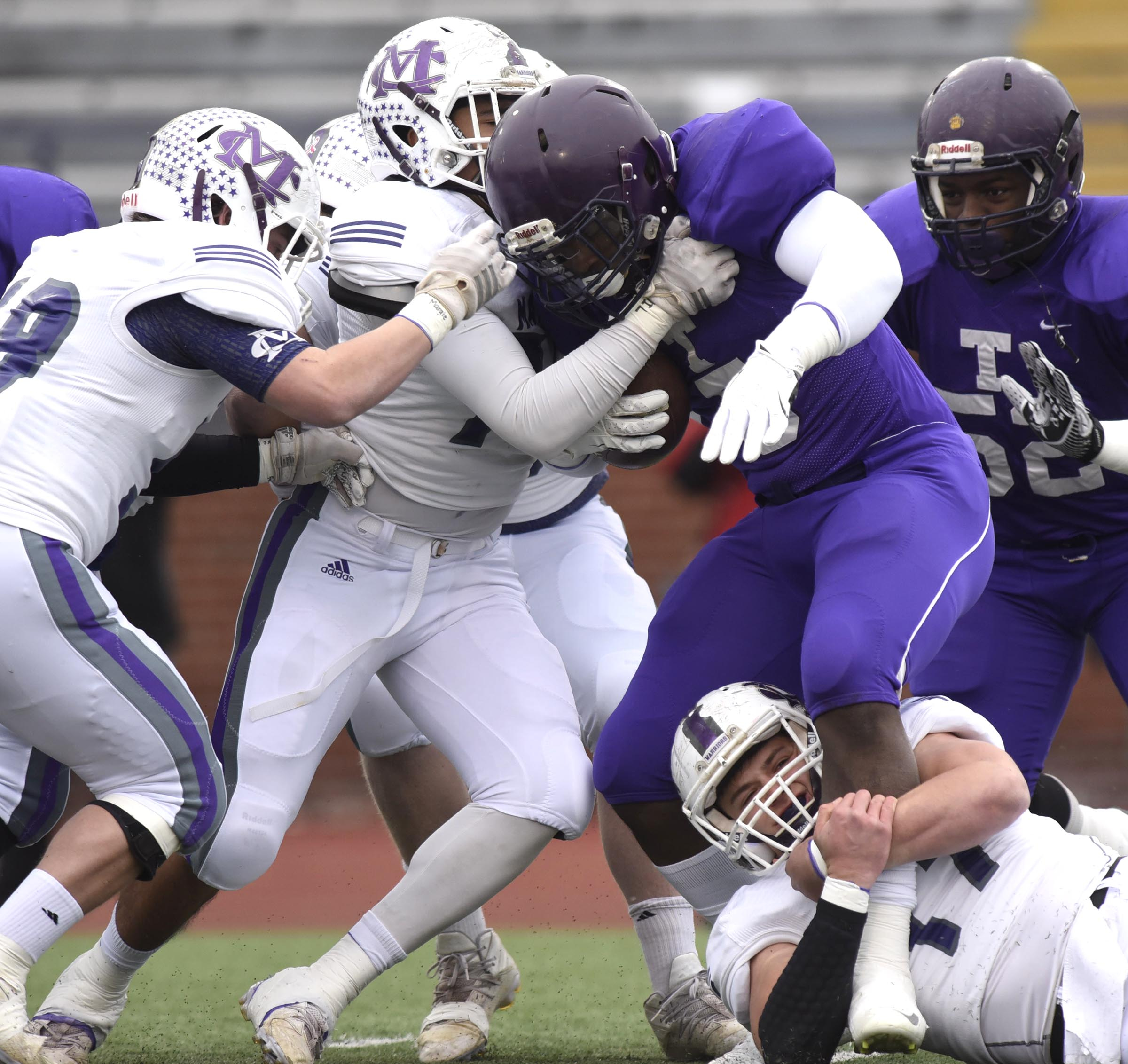 Marion County's defense gang tackles Treaevant's Cordarrian Richardson (5). The Marion County Warriors faced the Memphis Trezevant Bears in the Class AA TSSAA State Football Championship played in the BlueCross Bowl at Tennessee Tech in Cookeville on December 3, 2016.