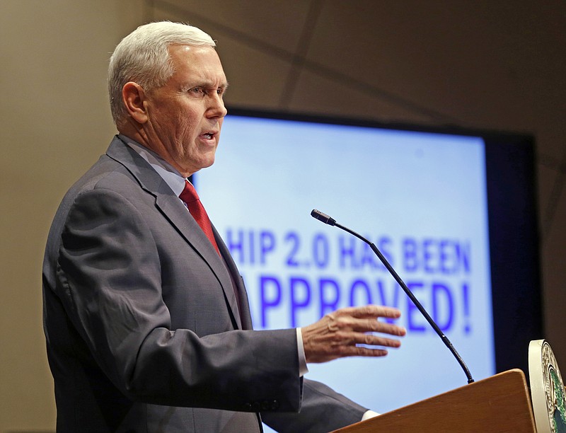 FILE - In this Jan. 27, 2015, file photo, Indiana Republican Gov. Mike Pence announces that the Centers for Medicaid and Medicare Services had approved the state's waiver request, called HIP 2.0, during a speech in Indianapolis. Pence told Republican governors meeting in Florida on Nov. 14, 2016, that Donald Trump would replace traditional Medicaid funding to states with block grants that “encourage innovation that better delivers health care to eligible residents,” according to a statement from the Trump transition team. (AP Photo/Michael Conroy, File)