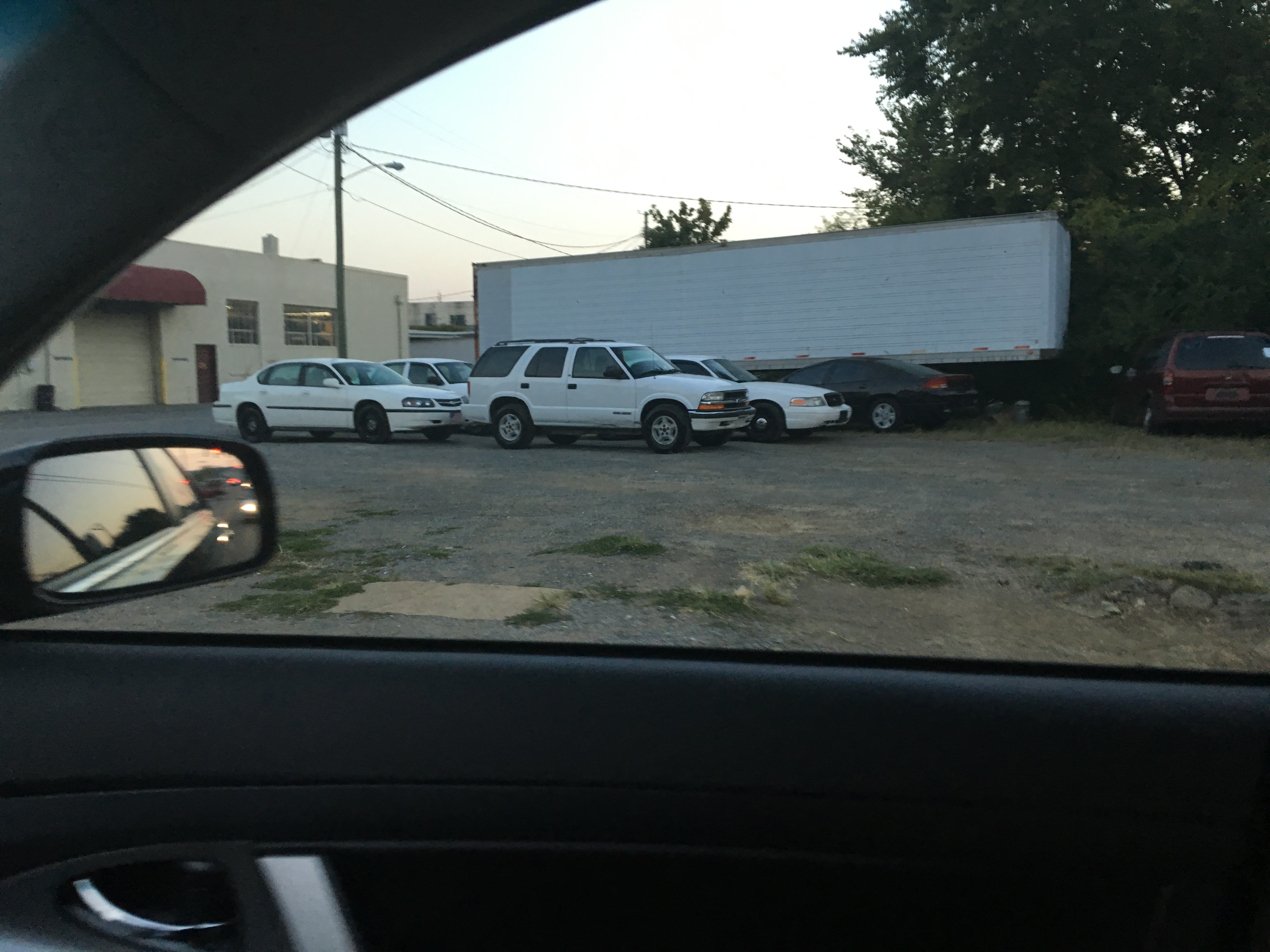 This photo taken outside Eric Watson's father's tire shop shows some of the cars the sheriff bought.