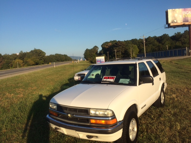 Cars for sale in front of the Benton Police Department in Polk County.