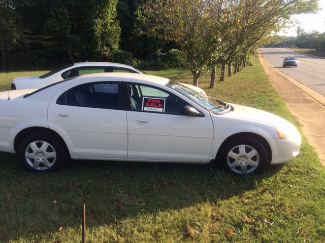 Cars for sale in front of the Benton Police Department in Polk County.
