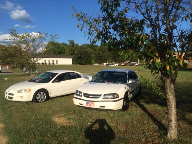 Cars for sale in front of the Benton Police Department in Polk County.