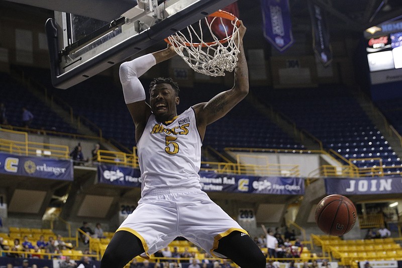 UTC forward Justin Tuoyo dunks during the Mocs' basketball game against Louisiana-Monroe at Finley Stadium on Saturday, Dec. 3, 2016, in Chattanooga, Tenn.