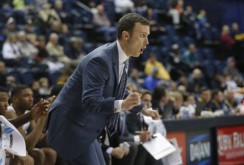UTC men's basketball coach Matt McCall shouts to players from the sidelines during the Mocs' basketball game against Louisiana-Monroe at Finley Stadium on Saturday, Dec. 3, 2016, in Chattanooga, Tenn.