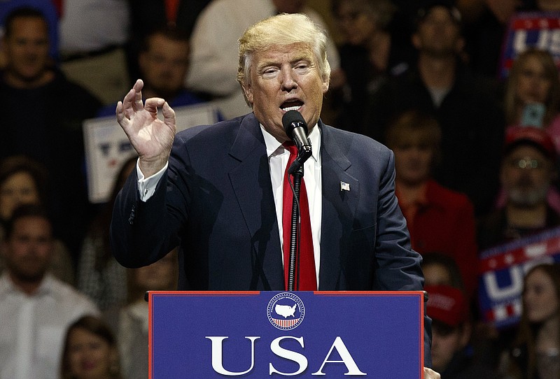 
              FILE - In this Dec. 1, 2016, photo, President-elect Donald Trump gestures as he speaks during a "USA Thank You" tour event in Cincinnati. Russia’s government staunchly denies reports that it tampered in the U.S. election or supported either candidate, but once the results were in, members of President Vladimir Putin’s United Russia party didn’t hold back. (AP Photo/Evan Vucci)
            