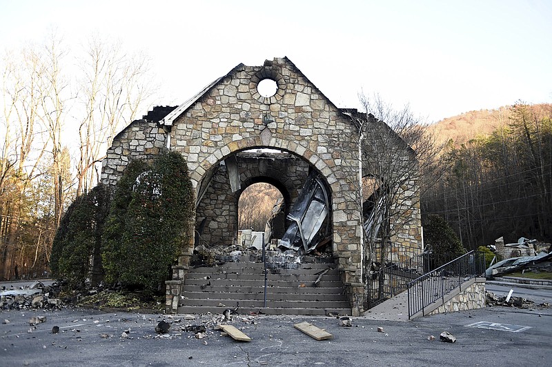 
              The stone walls are all that stands of the Roaring Fork Baptist Church in Gatlinburg, Tenn., Friday, Dec. 2, 2016, following the devastating wildfires from Monday night, Nov. 28. (Amy Smotherman Burgess/Knoxville News Sentinel via AP)
            