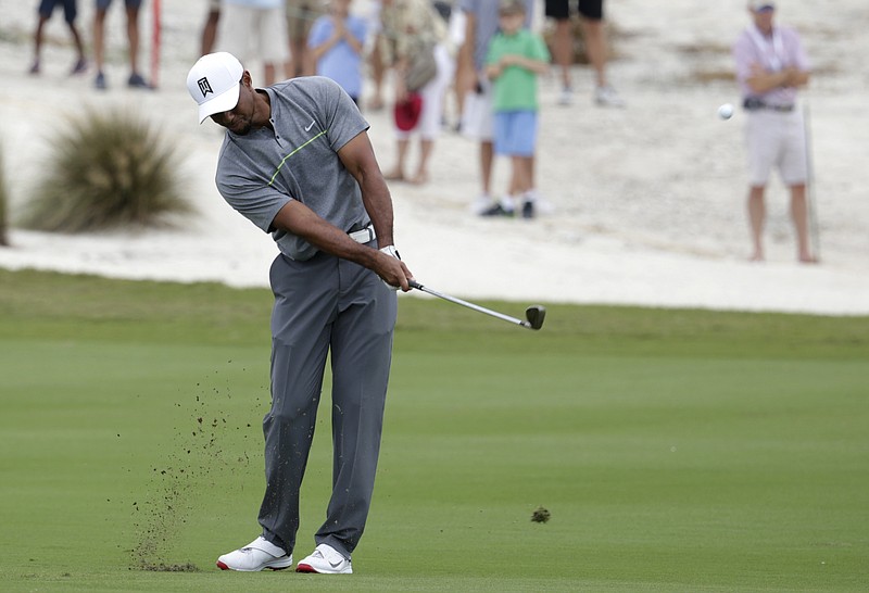 
              Tiger Woods hits from the first fairway during the third round at the Hero World Challenge golf tournament, Saturday, Dec. 3, 2016, in Nassau, Bahamas. (AP Photo/Lynne Sladky)
            