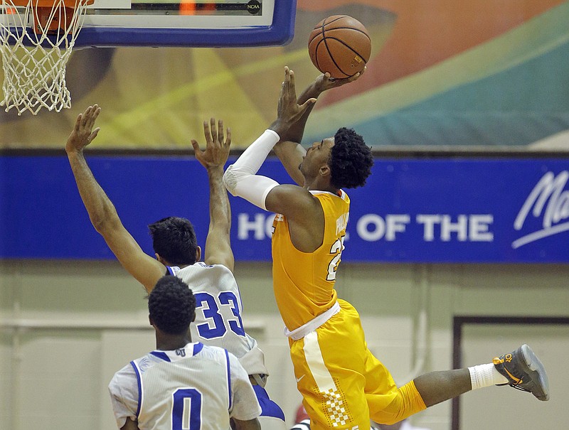 Tennessee guard Shembari Phillips shoots as Chaminade guard Kiran Shastri (33) defends while teammate Austin Pope (0) looks on during a game last month at the Maui Invitational in Lahaina, Hawaii.