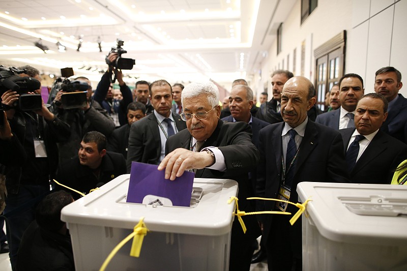 
              Palestinian president Mahmud Abbas casts his vote at the Muqataa, the Palestinian Authority headquarters, in the city of Ramallah, West Bank, Saturday Dec. 3, 2016. (Ahmad Gharabli/Pool photo via AP)
            