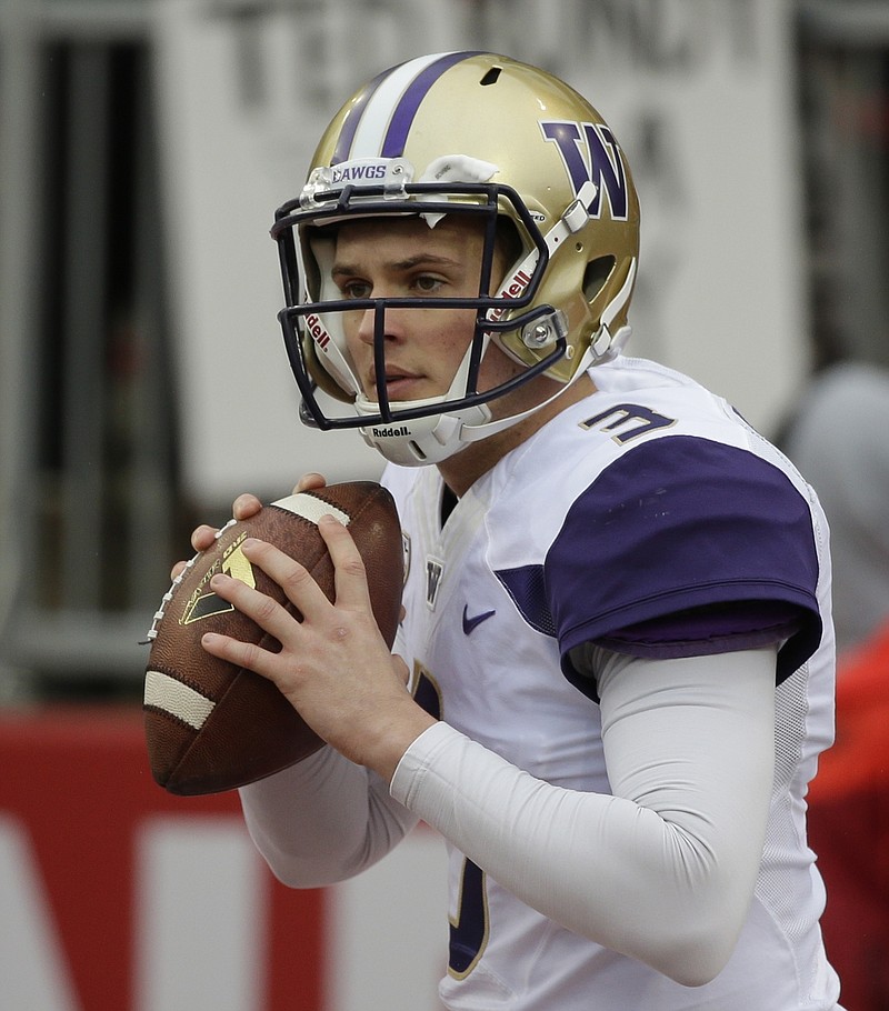 
              FILE - In this Nov. 25, 2016, file photo, Washington quarterback Jake Browning warms up before an NCAA college football game against Washington State, in Pullman, Wash. The fourth-ranked Huskies take on Colorado in the Pac-12 championship on Friday night in Santa Clara, Calif. Both teams rely heavily on their quarterbacks.  (AP Photo/Ted S. Warren, File)
            