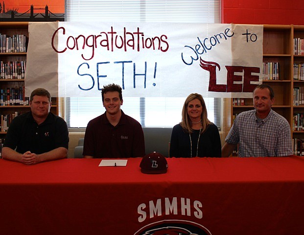 Signal Mountain High School baseball player Seth Wicker signs with Lee University. From left are SMHS baseball coach Josh Gandy, Seth and parents Leah and Scott Wicker.