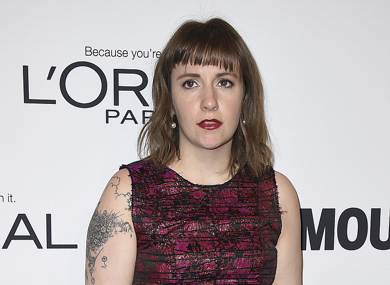
              FILE - In this Monday, Nov. 14, 2016, file photo, Lena Dunham arrives at the Glamour Women of the Year Awards at NeueHouse Hollywood in Los Angeles. "Girls" creator Dunham and author-essayist Ta-Nehisi Coates were strangers until this week, but are finding they have a lot in common. Dunham and Coates spoke on Monday, Dec. 5, at a New York City event sponsored by the MacDowell artist colony. (Photo by Jordan Strauss/Invision/AP, File)
            