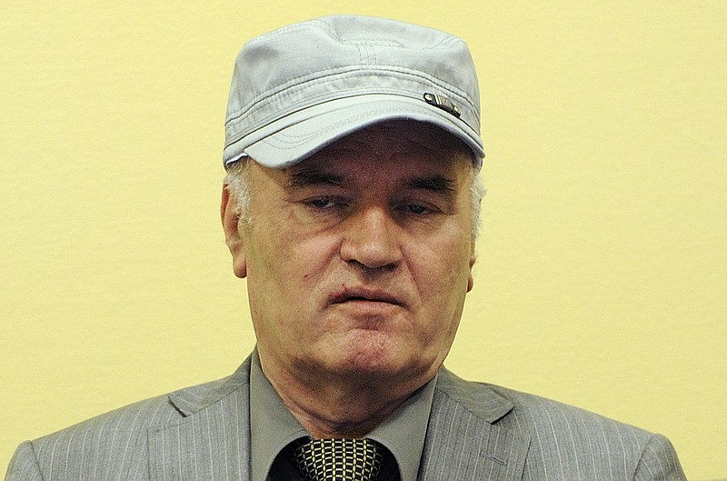 
              FILE - In this Friday, June 3, 2011, file photo former Bosnian Serb Gen. Ratko Mladic sits in the court room during his initial appearance at the U.N.'s Yugoslav war crimes tribunal in The Hague, Netherlands. UN prosecutors deliver their closing statement in the marathon genocide trial of former Bosnian Serb military chief Gen. Ratko Mladic, who is accused of commanding forces responsible for the worst atrocities of the Bosnian war. (AP Photo/ Martin Meissner, Pool, File)
            