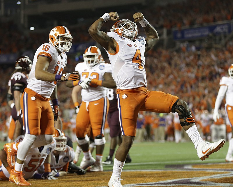 Clemson quarterback Deshaun Watson (4) celebrates his touchdown, during the second half of the Atlantic Coast Conference championship NCAA college football game against Virginia Tech, Saturday, Dec. 3, 2016, in Orlando, Fla.