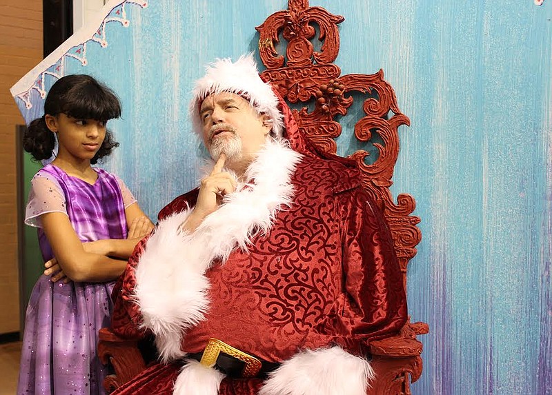 In the Chattanooga Theatre Centre's MainStage production of "Miracle on 34th Street," young Susan Walker (played by Tessie Kelly) has doubts about whether Kriss Kringle (Patrick Brady) is the real Santa Claus, as he claims to be.