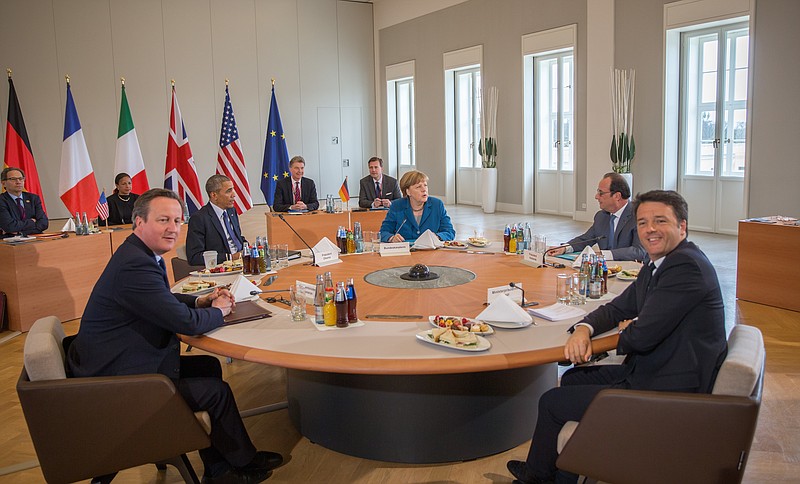 
              FILE - In this April 25, 2016 file photo British Prime Minister David Cameron, U.S. President Barack Obama,  German Chancellor Angela Merkel,  French President Francois Hollande, and Italy's Prime Minister Matteo Renzi, clockwise from left, start their G-5 meeting in Herrenhaus Palace in Hannover, northern Germany. Just a few months ago, German Chancellor Angela Merkel brought together the leaders of the U.S., Britain, France and Italy to discuss the world’s crises, a moment captured in a photo of the five seated around a conference table. When she hosts a summit of 20 leading global powers in July, she will be the only one of those leaders left _ and the policies her partners worked for may have been reversed.(Michael Kappeler/ File pool photo via AP)
            