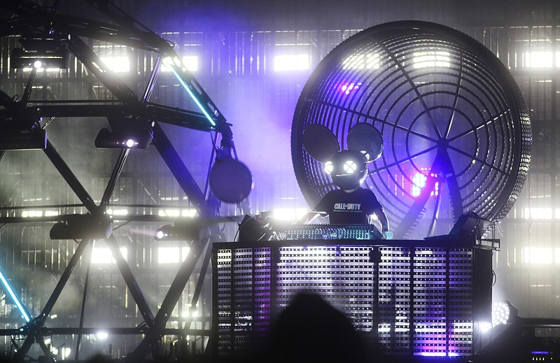 
              FILE - In this Saturday, Oct. 10, 2015, file photo, Deadmau5 performs during the Austin City Limits Music Festival in Zilker Park in Austin, Texas. Electronic music producer Deadmau5 and hip hop artists Travis Scott, Young Thug and Lil Yachty are among the headliners for the 2017 installment of the BUKU Music + Art Project, which fuses electronic, hip hop and indie rock in New Orleans' warehouse district. Organizers on Tuesday, Dec. 6, 2016, unveiled the lineup. (Photo by Jack Plunkett/Invision/AP, File)
            