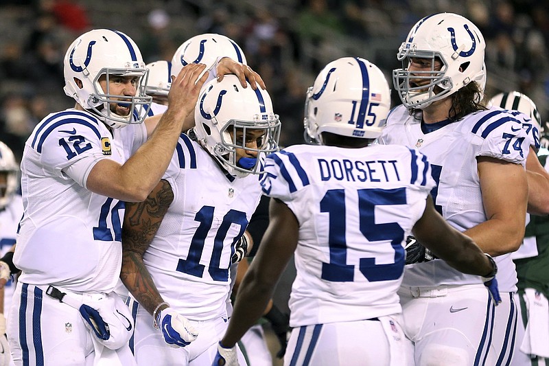Indianapolis Colts quarterback Andrew Luck, left, celebrates with wide receiver Donte Moncrief (10) after the two connected for a touchdown pass during the second half of an NFL football game against the New York Jets, Monday, Dec. 5, 2016, in East Rutherford, N.J.