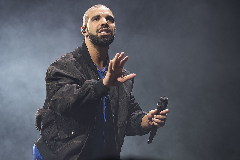 
              FILE - In this Oct. 8, 2016 file photo, Drake performs onstage in Toronto. Drake along with Rihanna and Kanye West scored eight Grammy nominations each, announced Tuesday, Dec. 6. (Photo by Arthur Mola/Invision/AP, File)
            