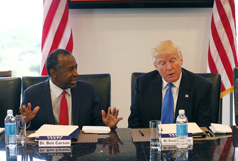 In this Aug. 25, 2016, photo, former Republican presidential candidate Dr. Ben Carson during Republican presidential candidate Donald Trump's roundtable meeting with the Republican Leadership Initiative in his offices at Trump Tower in New York. Trump has chosen former Campaign 2016 rival Ben Carson to become secretary of the Department of Housing and Urban Development.