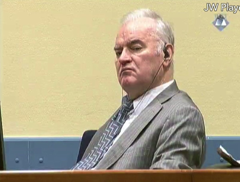 
              Former Bosnian Serb military chief General Ratko Mladic looks across the court room at the  International Criminal Tribunal for the Former Yugoslavia in the Hague Netherlands in this image taken from video Monday Dec. 5, 2016.  Mladic "called the shots" as his troops murdered and expelled thousands of civilians to carve out an ethnically pure Serb mini-state in Bosnia during the Balkan nation's 1992-95 war, a United Nations prosecutor said Monday as Mladic's genocide trial neared its end. (ICTY Video via AP)
            