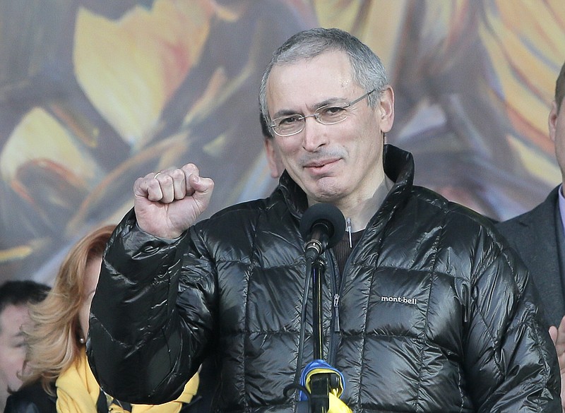 
              FILE - In this March 9, 2014 file photo, Russian former oil tycoon Mikhail Khodorkovsky cheers people during a rally in Independence Square in Kiev, Ukraine. A Dublin judge ordered authorities on Wednesday, Dec. 7, 2016, to unfreeze 100 million euros ($107 million) in cash belonging to Khodorkovsky, ruling that police had provided no evidence that the funds were illegally gained as Russia contends. (AP Photo/Efrem Lukatsky, File)
            