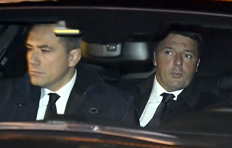 
              Italian Premier Matteo Renzi, right, arrives at the Quirinale presidential palace to meet President Sergio Mattarella and tender his resignation in Rome, Monday, Dec. 5, 2016. Italian voters dealt Premier Matteo Renzi a resounding rebuke early Monday by rejecting his proposed constitutional reforms, plunging Europe’s fourth-largest economy into political and economic uncertainty. (Ettore Ferrari/ANSA via AP)
            