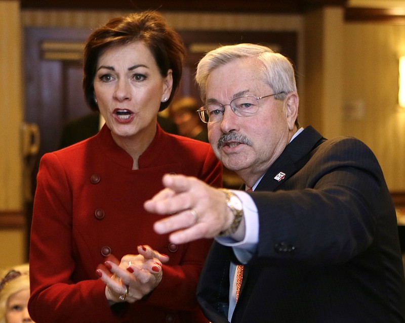 In this Nov. 4, 2014, file photo, Iowa Gov. Terry Branstad and Lt. Gov. Kim Reynolds, left, watch early election returns in West Des Moines, Iowa. 
