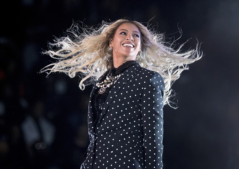 In this Nov. 4, 2016, file photo, Beyonce performs at a Get Out the Vote concert for Democratic presidential candidate Hillary Clinton in Cleveland. The pop star is the leader of the 2017 Grammys with nine nominations, including bids for album of the year with "Lemonade," and song and record of the year with "Formation," announced Tuesday, Dec. 6. The singer, who already has 20 Grammys, is also the first artist to earn nominations in the pop, rock, R&B and rap categories in the same year. (AP Photo/Andrew Harnik, File)