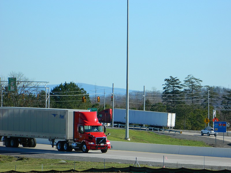 Freight trucks move along exit and entrance ramps at Exit 20 on Interstate 75 in Cleveland, Tenn.