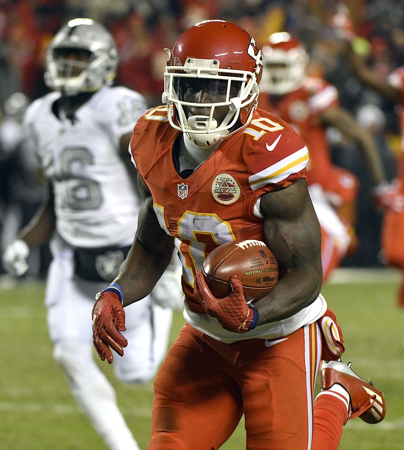 
              Kansas City Chiefs wide receiver Tyreek Hill (10) runs for a touchdown on a 78-yard kickoff return during the first half of an NFL football game against the Oakland Raiders in Kansas City, Mo., Thursday, Dec. 8, 2016. (AP Photo/Ed Zurga)
            