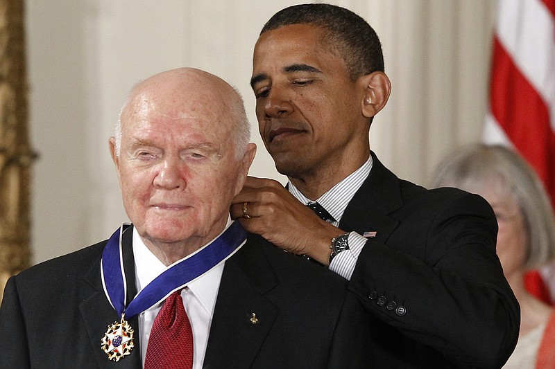 
              FILE - In this Tuesday, May 29, 2012, file photo, President Barack Obama awards the Medal of Freedom to former astronaut John Glenn during a ceremony in the East Room of the White House in Washington. Glenn, the first American to orbit Earth who later spent 24 years representing Ohio in the Senate, died Thursday, Dec. 8, 2016, at the age of 95. (AP Photo/Charles Dharapak, File)
            