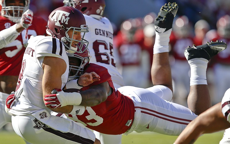 In this Oct. 22, 2016, file photo, Alabama defensive lineman Jonathan Allen (93) sacks Texas A&M quarterback Trevor Knight during the first half of an NCAA college football game, in Tuscaloosa, Ala. Allen took the honor of top defensive player of the year of The Associated Press All-Southeastern Conference team announced Thursday, Dec. 8, 2016.(AP Photo/Brynn Anderson, File)