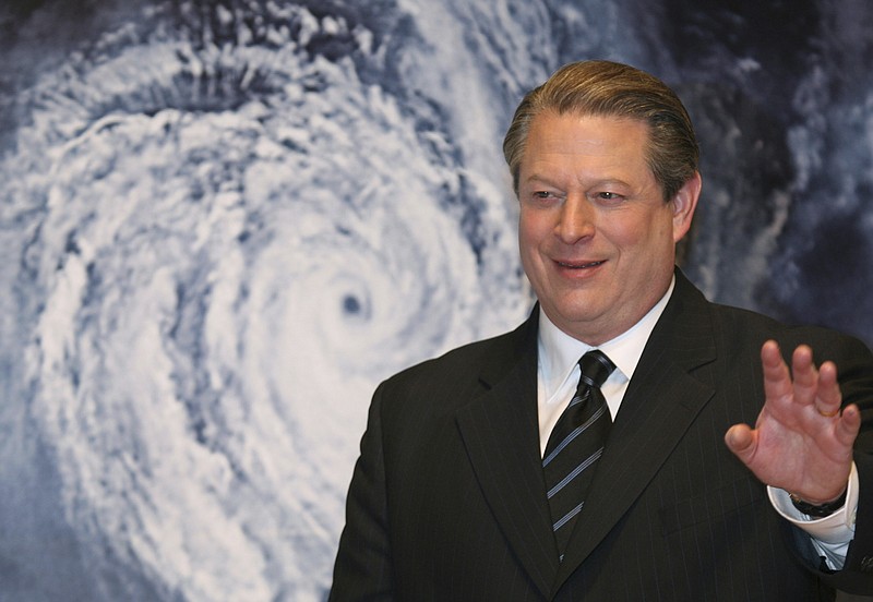 
              FILE - In this Jan. 15, 2007 file photo, former Vice President Al Gore acknowledges spectators in front of a poster of his starring documentary film "An Inconvenient Truth" on global warming before its screening during the Japan Premier at a theater in Tokyo. Gore's climate change documentary, "An Inconvenient Truth," is getting a sequel. Paramount Pictures said Friday, Dec. 9, 2016, the follow-up to the Oscar-winning original will premiere at next January's Sundance Film Festival. (AP Photo/Koji Sasahara, File)
            
