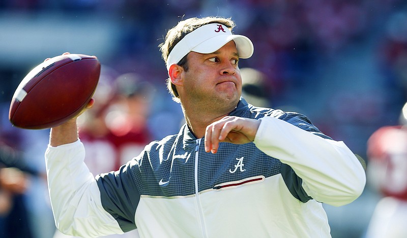 
              FILE - In this Saturday, Nov. 26, 2016 file photo, Alabama offensive coordinator Lane Kiffin throws a pass during warmups before the Iron Bowl NCAA football game against Auburn  in Tuscaloosa, Ala. Alabama offensive coordinator Lane Kiffin is being pursued by Florida Atlantic to become the Owls' next head coach, two people with knowledge of the situation told The Associated Press on Friday night, Dec. 9, 2016. (AP Photo/Butch Dill, File)
            