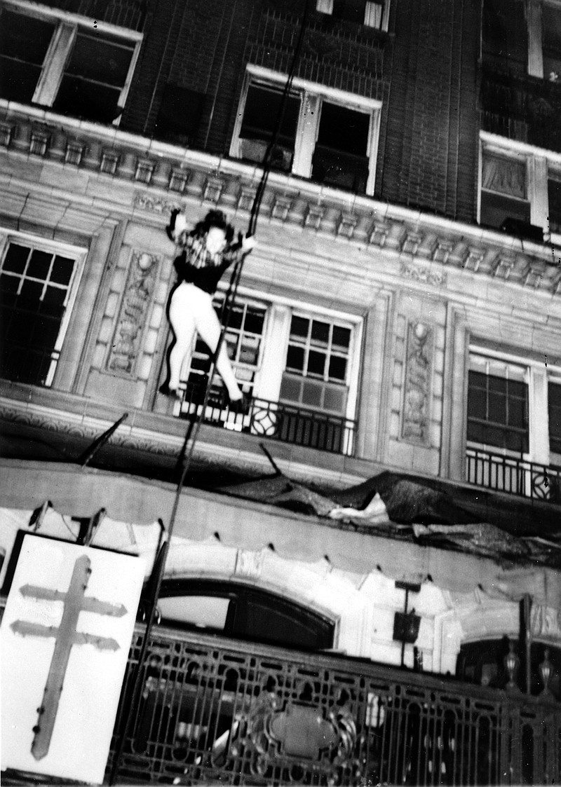 
              In this Dec. 7, 1946 photo, a woman leaps from an upper story to escape the burning Winecoff Hotel in Atlanta. Seconds later the woman crashed to her death on the hotel marquee. An amateur photographer captured the horror of a woman leaping to escape flames roaring through the Winecoff Hotel in Atlanta in 70 years ago, killing 119 people and leading President Truman to call for new fire safety codes nationwide. (AP Photo/Arnold Hardy)
            