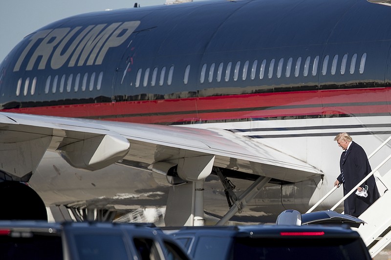 
              President-elect Donald Trump arrives at Baton Rouge Metropolitan Airport, Friday, Dec. 9, 2016, in Baton Rouge, La., to attend a rally. (AP Photo/Andrew Harnik)
            